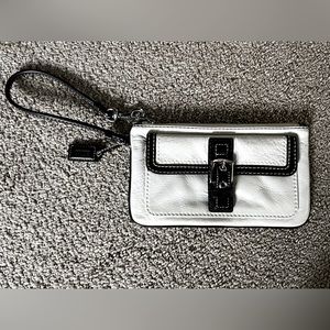 White and dark brown leather Coach wristlet